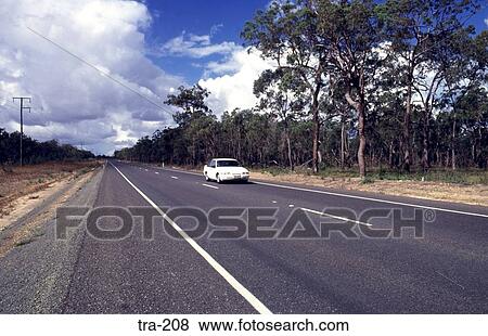 Car on a Long Straight Highway Australia View Large Photo Image Stock Photo - Car on a Long Straight Highway Australia. Fotosearch