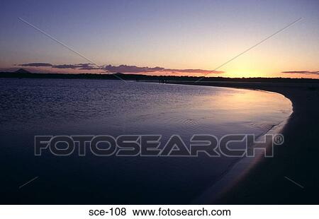 Curving Beach at Sunset Australia View Large Photo Image Stock Photo - Curving Beach at Sunset Australia. Fotosearch