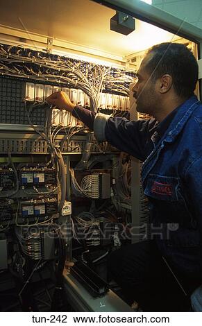 Stock Image - Engineer Working in Cabinet Power Plant Tunisia. Fotosearch