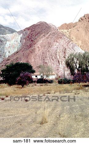 Stock Image - Farm House beneath Rock Outcrop Patagonia Argentina. Fotosearch