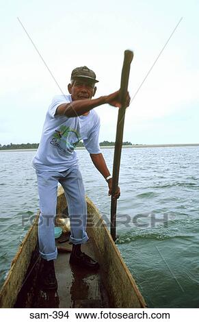 Ferryman Using Dugout Canoe Esmeraldas Ecuador View Large Photo Image Picture - Ferryman Using Dugout Canoe Esmeraldas Ecuador. Fotosearch