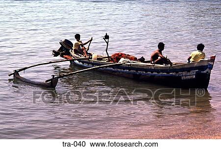 Fishermen Paddling in a Dugout Boat India View Large Photo Image Stock Image - Fishermen Paddling in a Dugout Boat India. Fotosearch