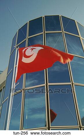 Stock Photograph - Flag and Office Block Sousse Tunisia. Fotosearch