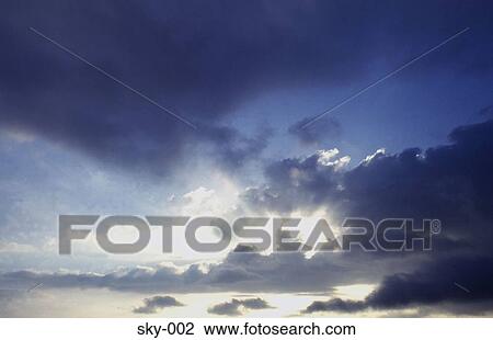 Grey and White Cumulus Clouds against a Blue Sky View Large Photo Image Stock Image - Grey and White Cumulus Clouds against a Blue Sky. Fotosearch