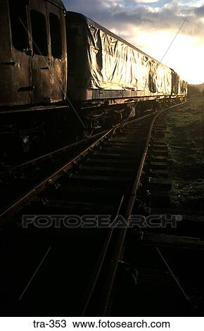 Low Sun Reflecting off Disused Railway Carriages View Large Photo Image Stock Image - Low Sun Reflecting off Disused Railway Carriages. Fotosearch