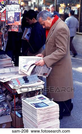 Man Reading Newspaper at a Kiosk Buenos Aires View Large Photo Image Stock Photo - Man Reading Newspaper at a Kiosk Buenos Aires. Fotosearch