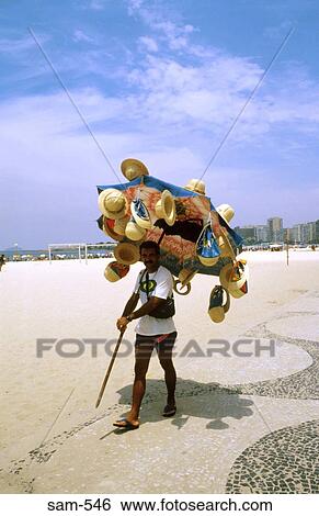 Man Selling Straw Hats on Rio Beach Brazil View Large Photo Image Stock Photograph - Man Selling Straw Hats on Rio Beach Brazil. Fotosearch