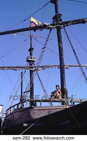 Man Sitting on Railing on Sailing Ship Colombia View Large Photo Image Stock Image - Man Sitting on Railing on Sailing Ship Colombia. Fotosearch