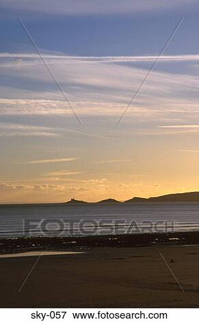 Misty Sunset Mumbles Head Swansea Wales UK View Large Photo Image Stock Photo - Misty Sunset Mumbles Head Swansea Wales UK. Fotosearch