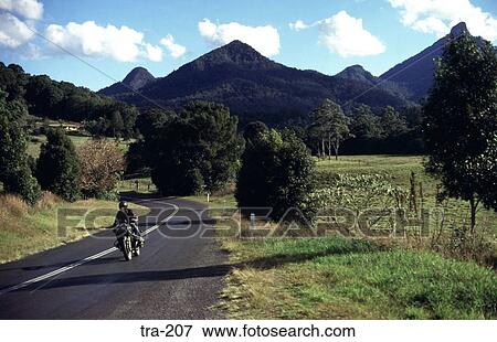 Stock Photo - Motorcycle on Road through Tweed Valley Australia. Fotosearch