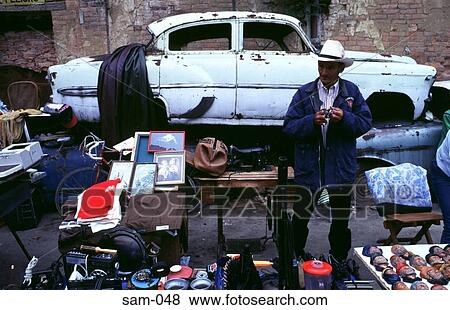 Stock Photo - Old Man in Cowboy Hat at Flea Market Bogota Colombia. Fotosearch