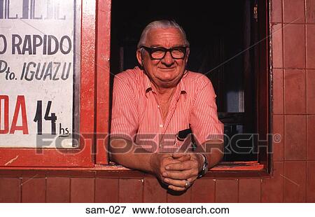 Old Man in Ticket Kiosk Iguazu Argentina View Large Photo Image Stock Photo - Old Man in Ticket Kiosk Iguazu Argentina. Fotosearch
