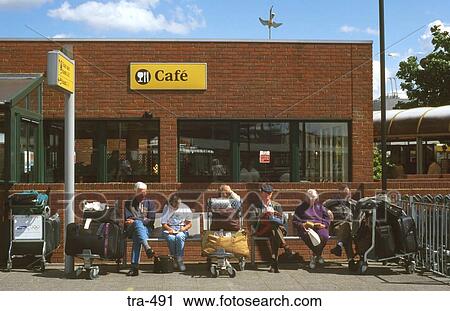 Stock Image - People at Heathrow Airport Bus Station. Fotosearch