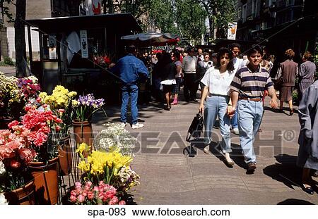 Stock Image - People Walking along Las Ramblas Barcelona Spain. Fotosearch