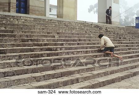 Picture - Pilgrim on Knees on Church Steps Colombia. Fotosearch