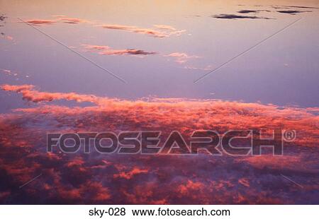 Pink Highlighted Cirrus Clouds in the Sky at Sunset View Large Photo Image Stock Photo - Pink Highlighted Cirrus Clouds in the Sky at Sunset. Fotosearch