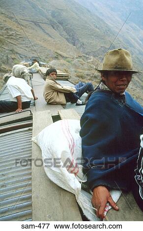 Stock Photo - Poor Passengers on Roof of Train Rural Ecuador. Fotosearch