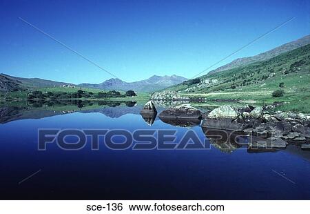 Reflections in a Welsh Mountain Lake UK View Large Photo Image Stock Photograph - Reflections in a Welsh Mountain Lake UK. Fotosearch