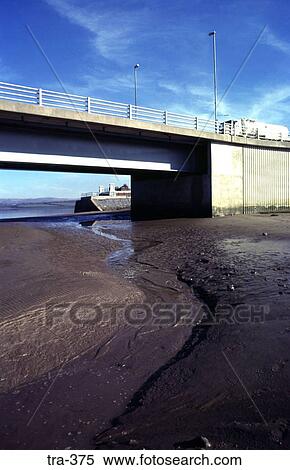 Stock Photography - Road Bridge over River at Low Tide. Fotosearch