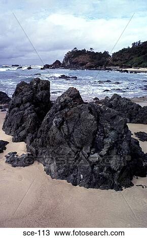 Stock Image - Rocks on a Sandy Beach New South Wales Australia. Fotosearch