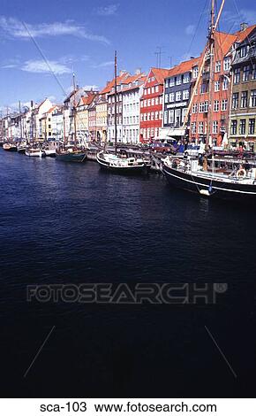Stock Image - Sailing Ships at Quayside Nyhaven Copenhagen Denmark. Fotosearch
