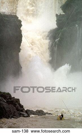 Small Boat at Foot of Iguazu Falls Argentina View Large Photo Image Stock Photo - Small Boat at Foot of Iguazu Falls Argentina. Fotosearch