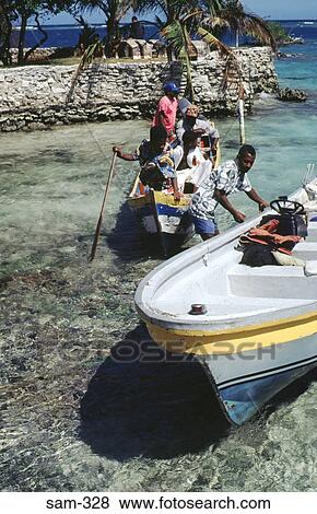 Small Boats on Blue Caribbean Sea Colombia View Large Photo Image Stock Photo - Small Boats on Blue Caribbean Sea Colombia. Fotosearch