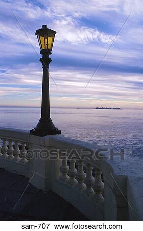 Street Lamp Silhouetted against Sea Colonia Uruguay View Large Photo Image Stock Photo - Street Lamp Silhouetted against Sea Colonia Uruguay. Fotosearch