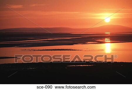 Stock Image - Sunset over an Estuary UK. Fotosearch