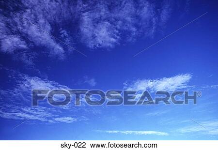 Stock Image - Thin Cirrus Clouds in a Blue Sky. Fotosearch