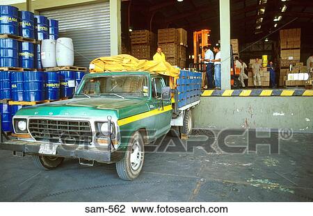 Stock Image - Truck Being Loaded at Factory Valencia Venezuela. Fotosearch