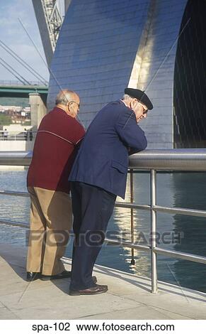 Two Men Leaning on Rails Bilbao Spain View Large Photo Image Stock Image - Two Men Leaning on Rails Bilbao Spain. Fotosearch