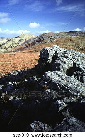 View of the Brecon Beacons over a Rock Outcrop UK View Large Photo Image Stock Image - View of the Brecon Beacons over a Rock Outcrop UK. Fotosearch