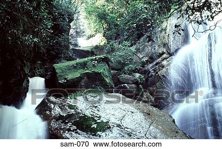 Waterfall over Rocks in the Jungle Venezuela View Large Photo Image Stock Image - Waterfall over Rocks in the Jungle Venezuela. Fotosearch