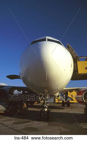 White Nose of Jet Airliner at Airport Gate View Large Photo Image Picture - White Nose of Jet Airliner at Airport Gate. Fotosearch