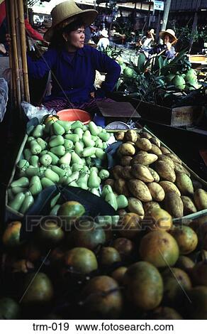 Stock Photo - Woman Trader Floating Market Thailand. Fotosearch