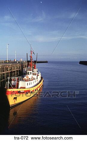 Yellow Tug Boat at Harbour Quayside UK View Large Photo Image Stock Image - Yellow Tug Boat at Harbour Quayside UK. Fotosearch