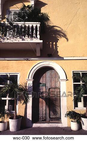 Arched Wooden Door in Yellow Wall View Large Photo Image Stock Image - Arched Wooden Door in Yellow Wall. Fotosearch