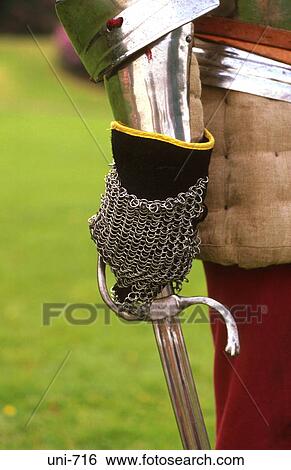 Stock Photograph - Armoured Hand with Sword. Fotosearch