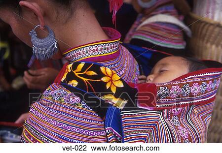 Stock Image - Baby in Back Carrier Vietnam Asia. Fotosearch