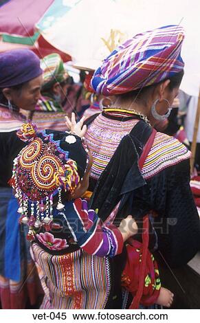Stock Photography - Baby in Back Carrier Vietnam Asia. Fotosearch