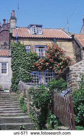 Stock Image - Back Garden and Cottage Robin Hoods Bay UK. Fotosearch