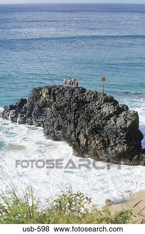 Bathers on Rock Waimea Bay Hawaii USA View Large Photo Image Stock Photo - Bathers on Rock Waimea Bay Hawaii USA. Fotosearch