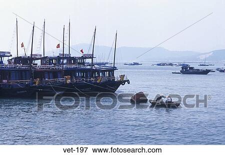 Boats in Halong Bay Vietnam View Large Photo Image Stock Photo - Boats in Halong Bay Vietnam. Fotosearch