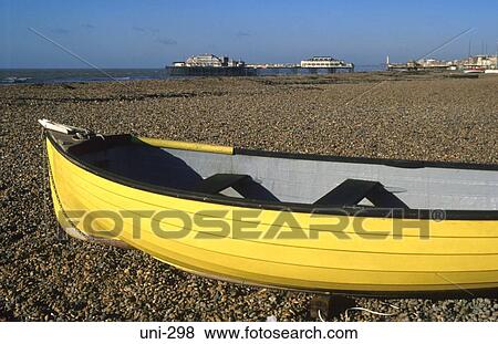 Bright Yellow Rowing Boat on Beach UK View Large Photo Image Stock Photo - Bright Yellow Rowing Boat on Beach UK. Fotosearch