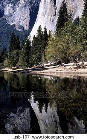 Cliffs and Trees Reflected in Lake Yosemite USA View Large Photo Image Stock Photo - Cliffs and Trees Reflected in Lake Yosemite USA. Fotosearch