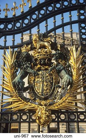 Stock Photo - Crest on Gates Buckingham Palace London UK. Fotosearch