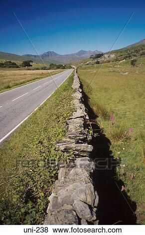 Dry Stone Wall and Rural Road Wales UK View Large Photo Image Stock Photo - Dry Stone Wall and Rural Road Wales UK. Fotosearch