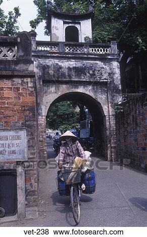 Heavily Laden Cyclist Old City Gate Hanoi Vietnam View Large Photo Image Stock Photo - Heavily Laden Cyclist Old City Gate Hanoi Vietnam. Fotosearch