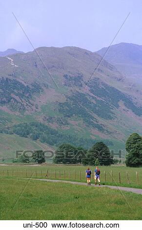 Hikers on Country Road Lake District UK View Large Photo Image Stock Image - Hikers on Country Road Lake District UK. Fotosearch
